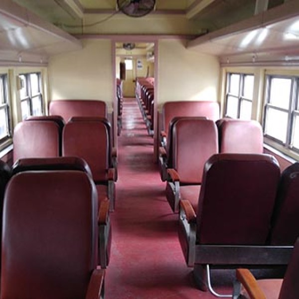 a living room filled with furniture and a large window