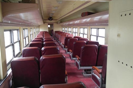 a living room filled with furniture and a large window