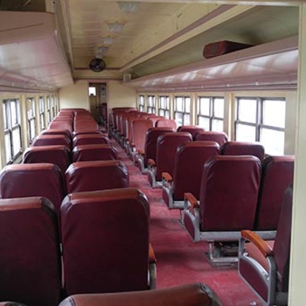 a living room filled with furniture and a large window