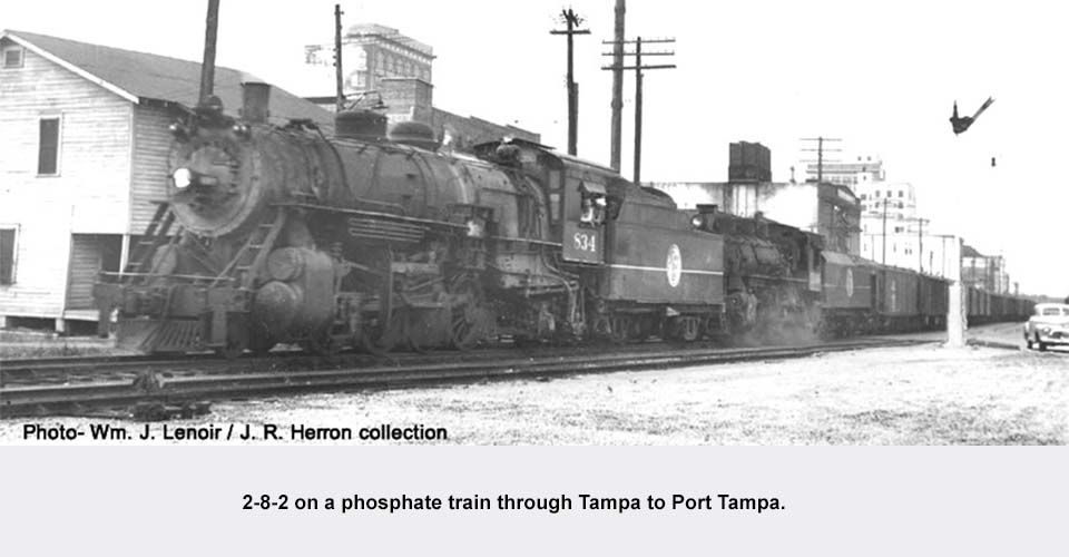 an old photo of a train on a steel track