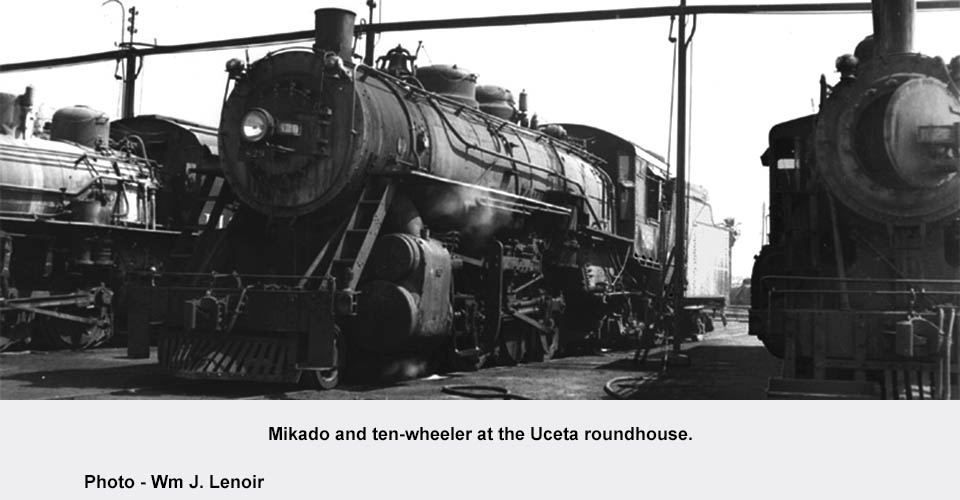 a vintage photo of a train on a steel track
