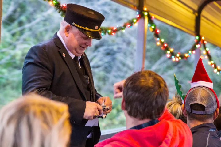 Conductor taking tickets